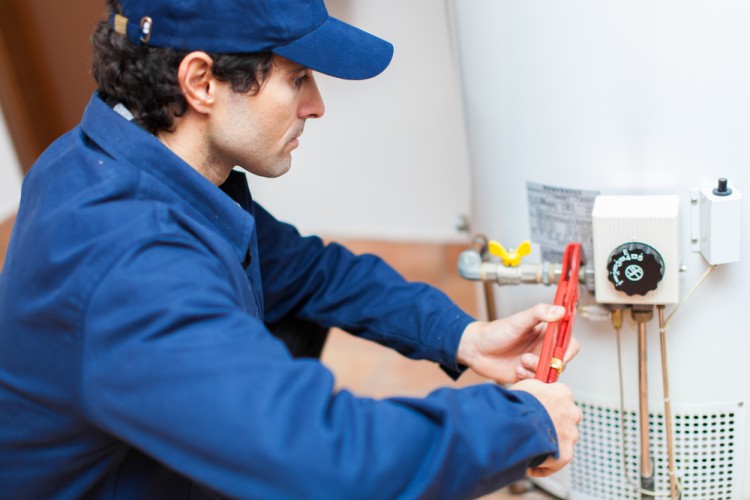 Plumber Fixing Water Heater